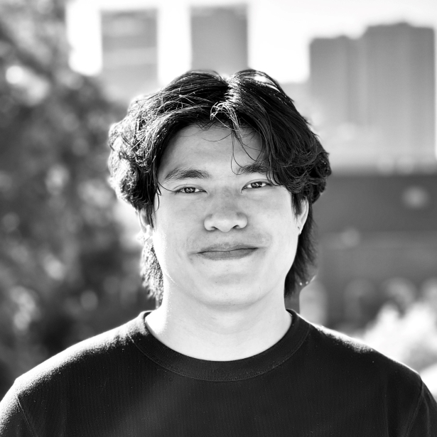 Black and white headshot of a student in a black shirt. 